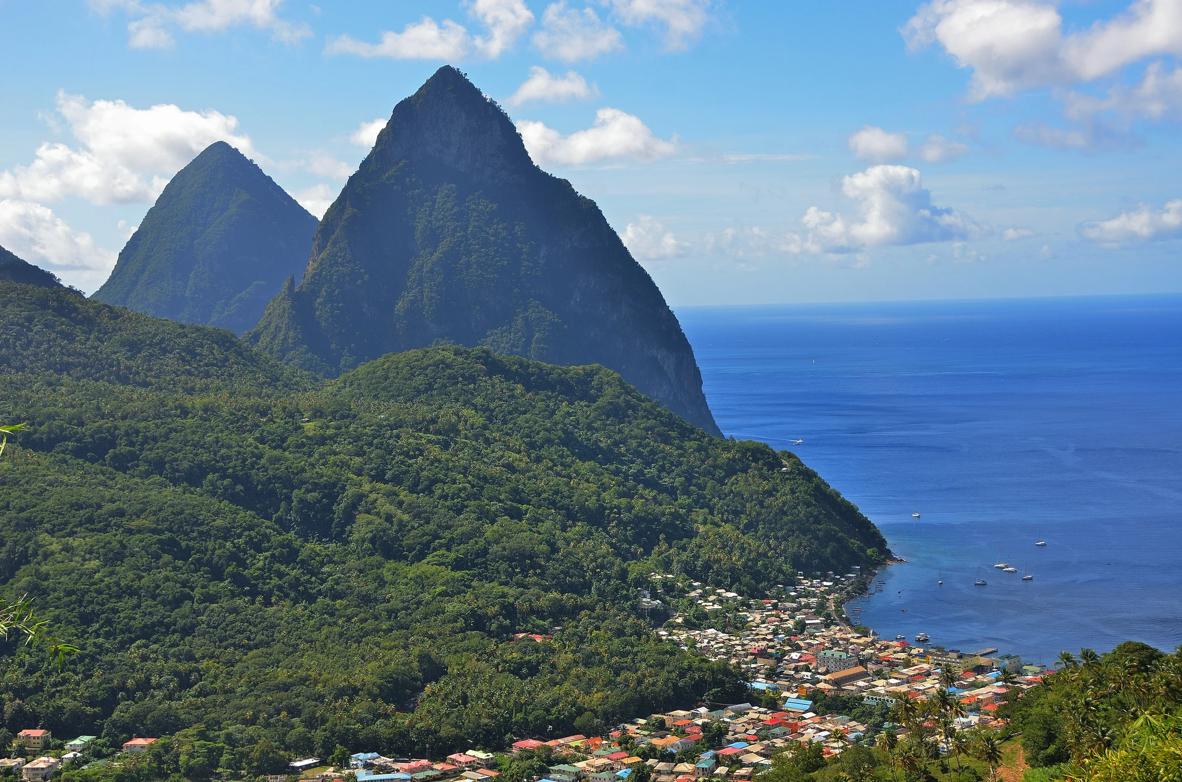 The Pitons rising sharply out of the Caribbean Sea — the unmistakable signature of St Lucia's landscape.