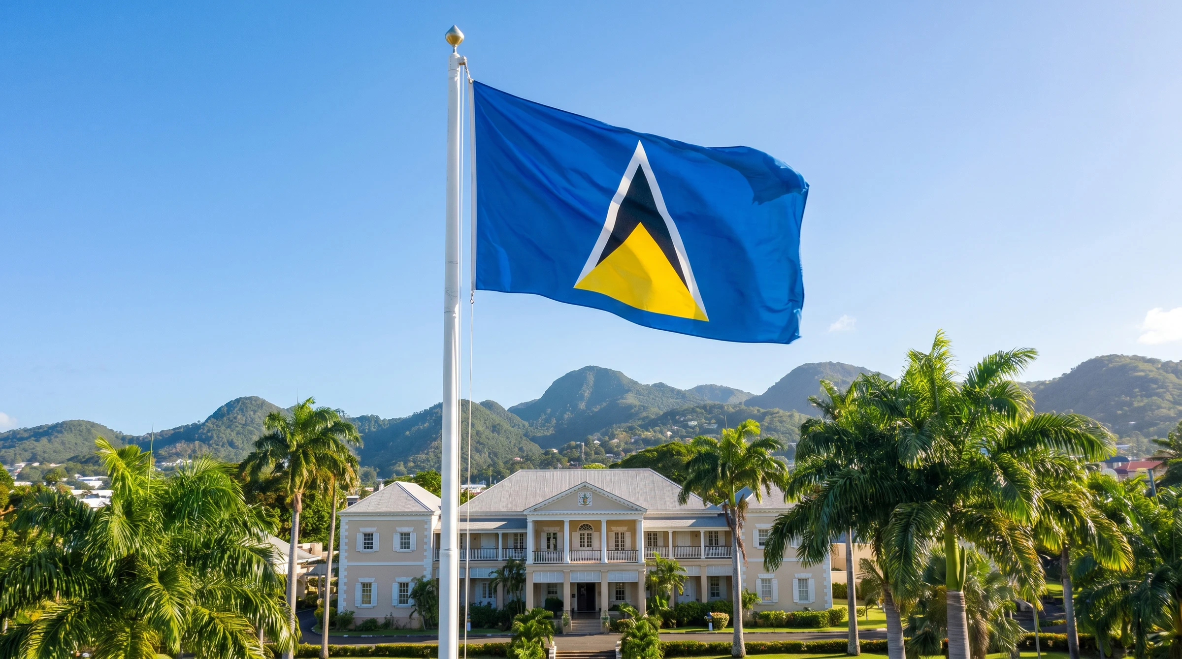 The flag of St Lucia flying at a government building.